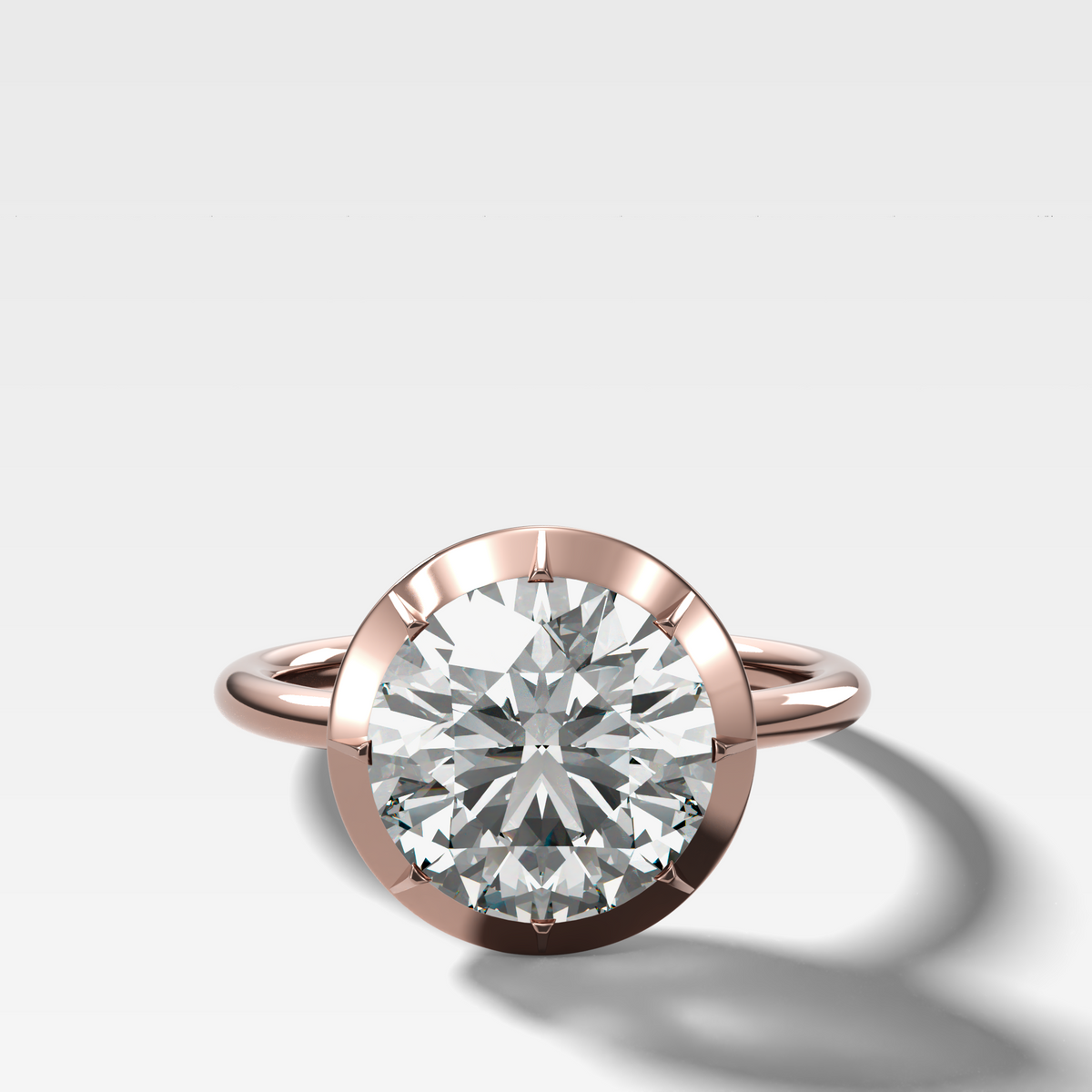 Button Back Solitaire Engagement Ring With a Round Cut Diamond