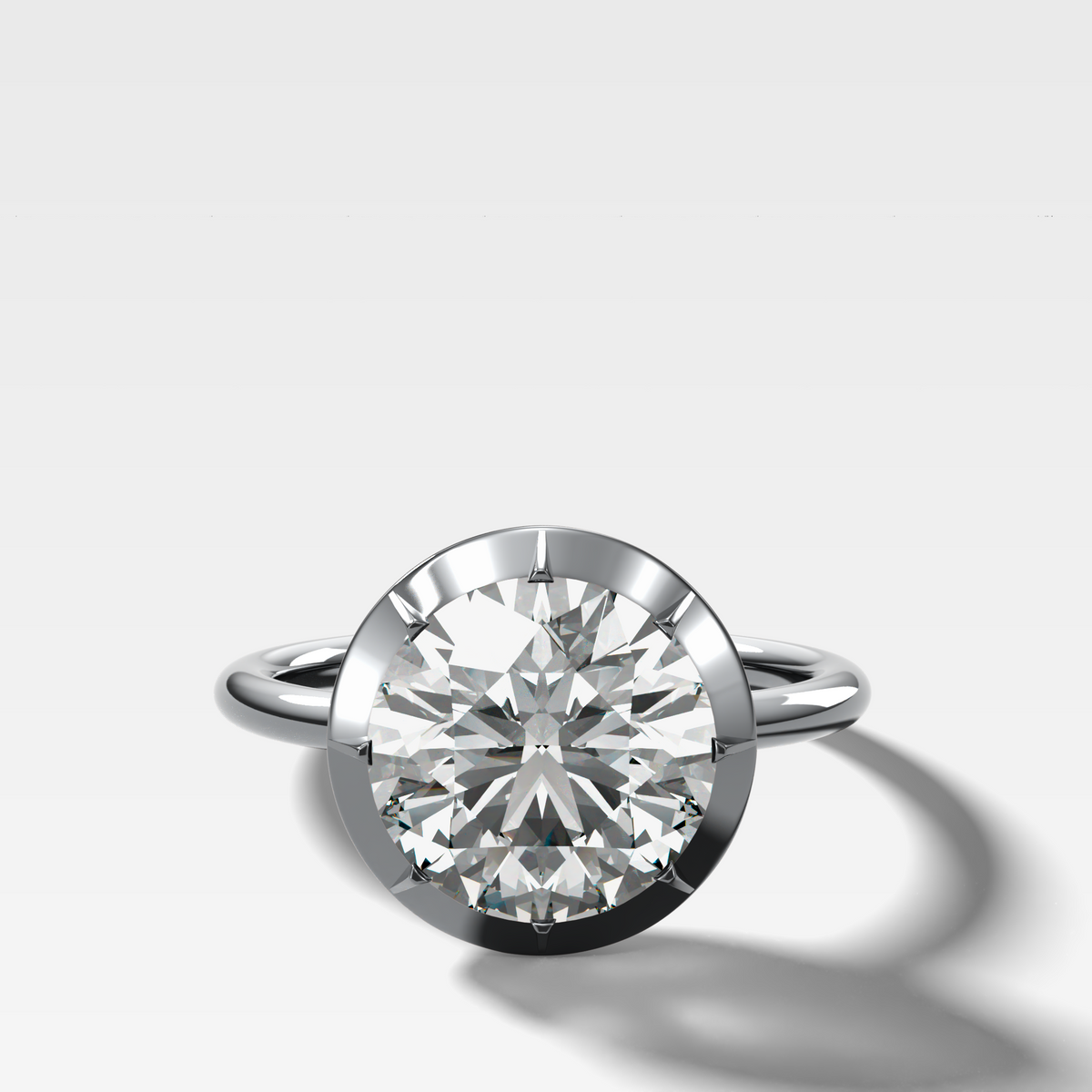 Button Back Solitaire Engagement Ring With a Round Cut Diamond