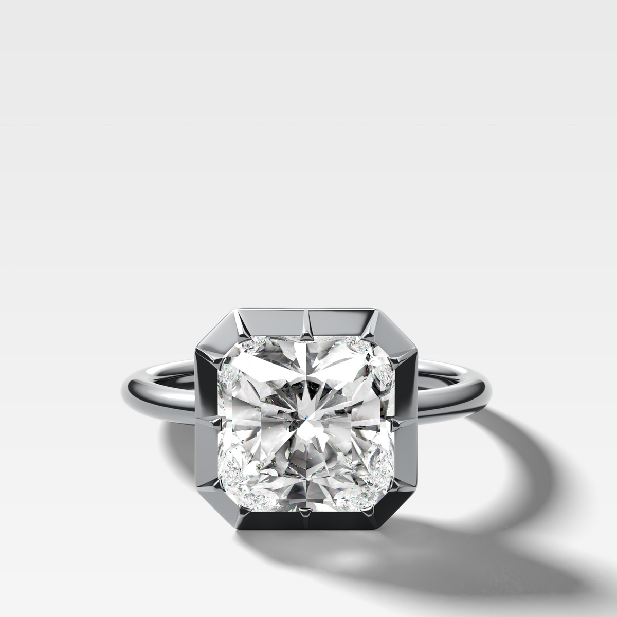 Button Back Solitaire Engagement Ring With a Square Radiant Cut Diamond