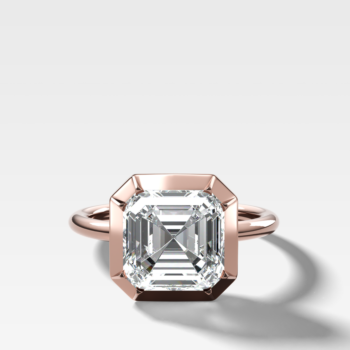 Button Back Solitaire Engagement Ring With an Asscher Cut Diamond
