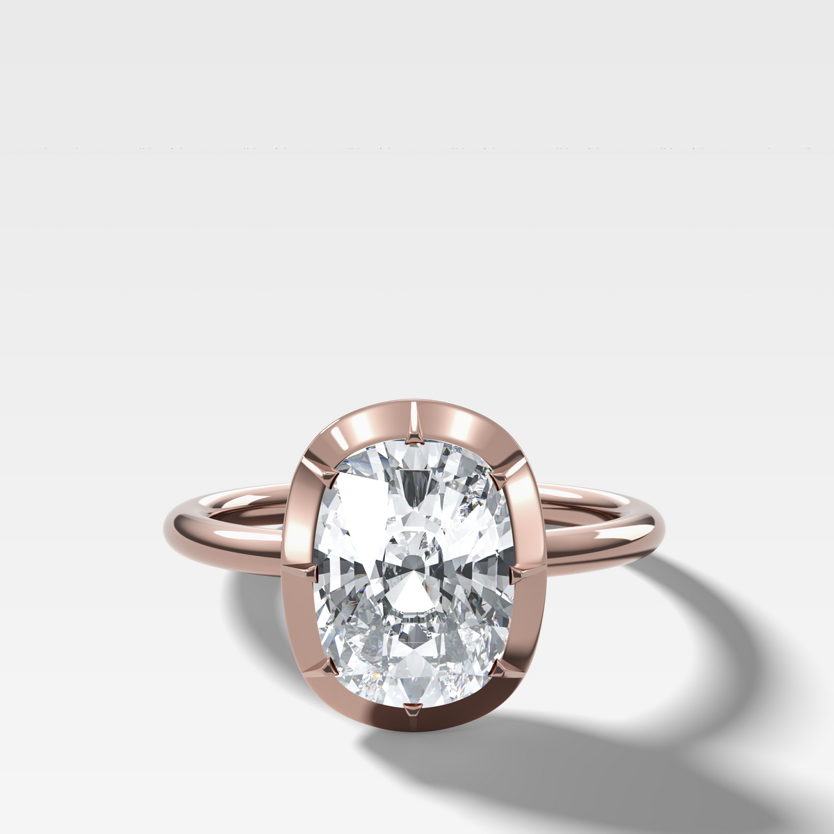 Button Back Solitaire Engagement Ring With an Elongated Cushion Cut Diamond