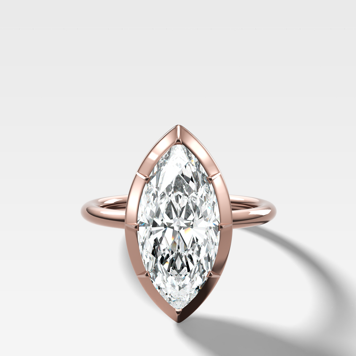 Button Back Solitaire Engagement Ring With a Marquise Cut Diamond