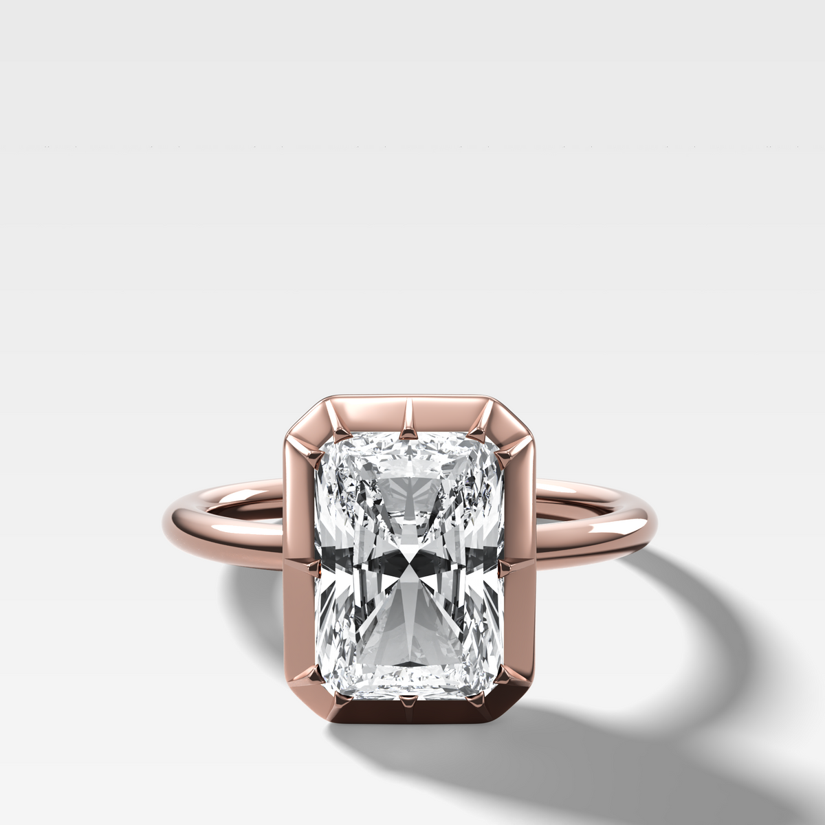 Button Back Solitaire Engagement Ring With an Elongated Radiant Cut Diamond