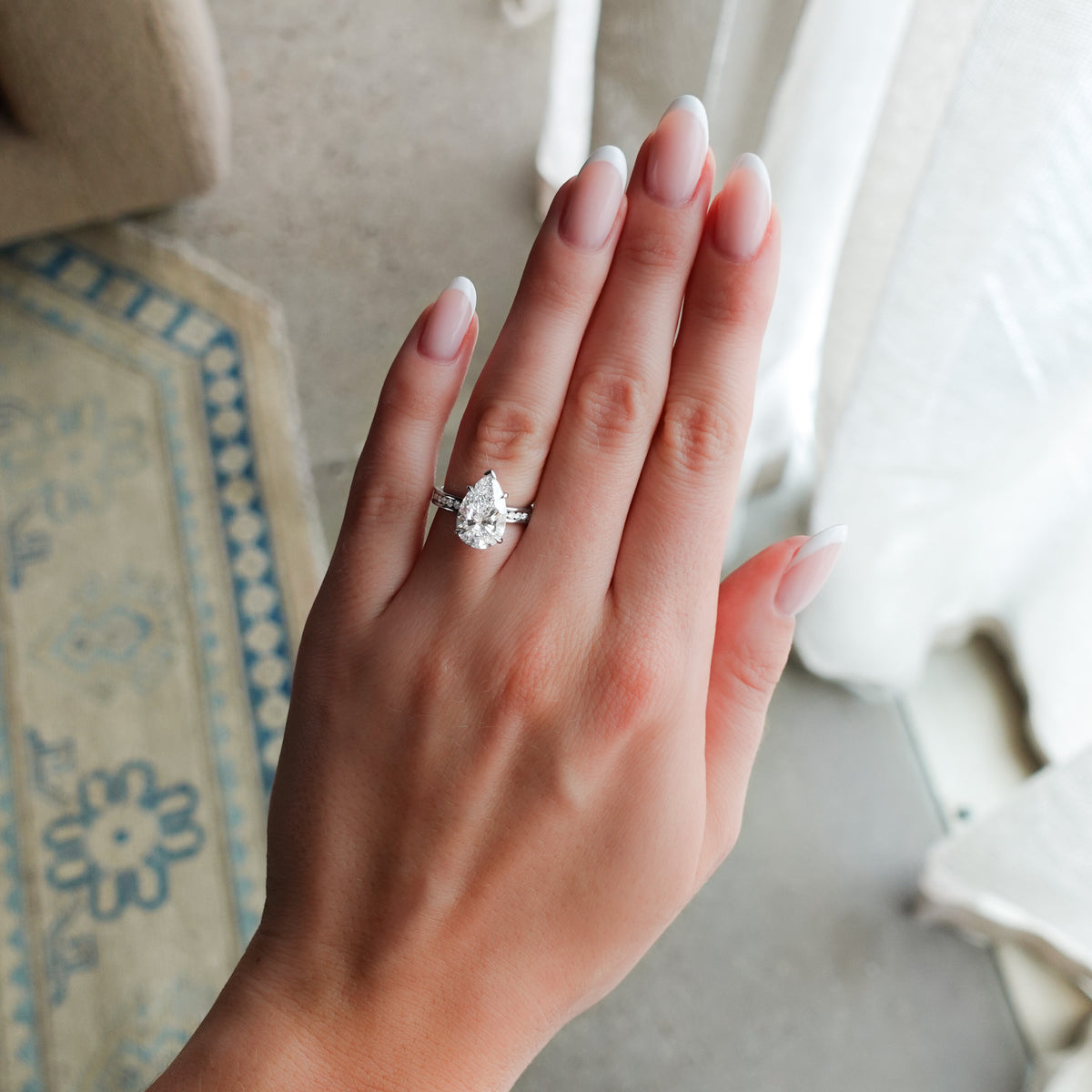 Petite Channel Set Engagement Ring with Pear Cut Diamond