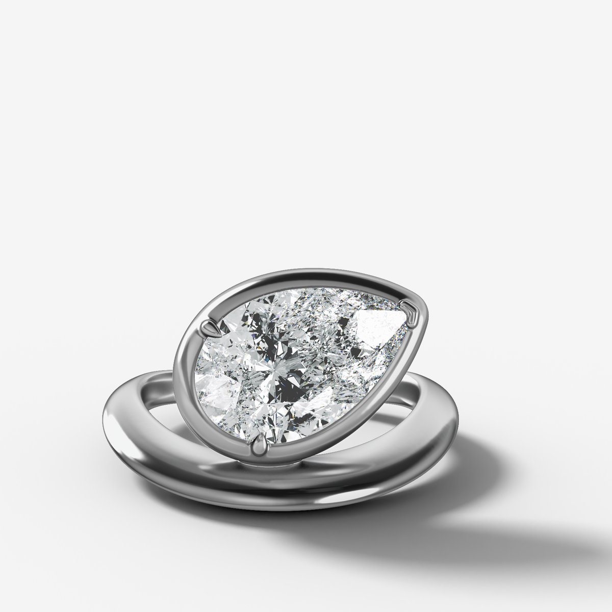 Contoured Club Engagement Ring with a Pear Cut Diamond
