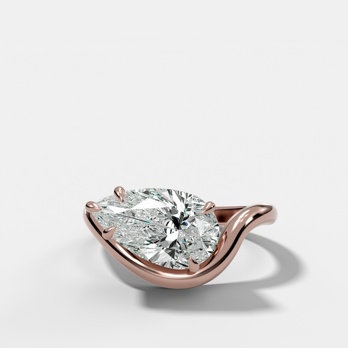 Contoured Engagement Ring with a Pear Cut Diamond
