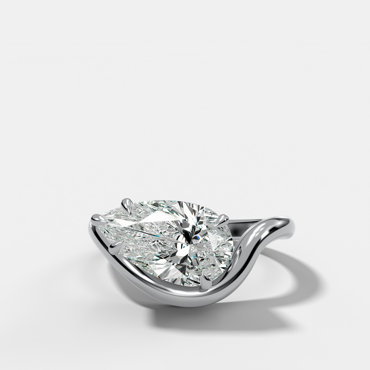 Contoured Engagement Ring with a Pear Cut Diamond