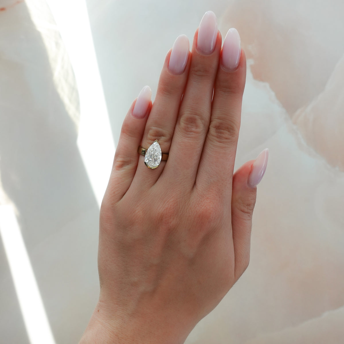 Finest Half Bezel Solitaire Engagement Ring With Pear Cut Diamond