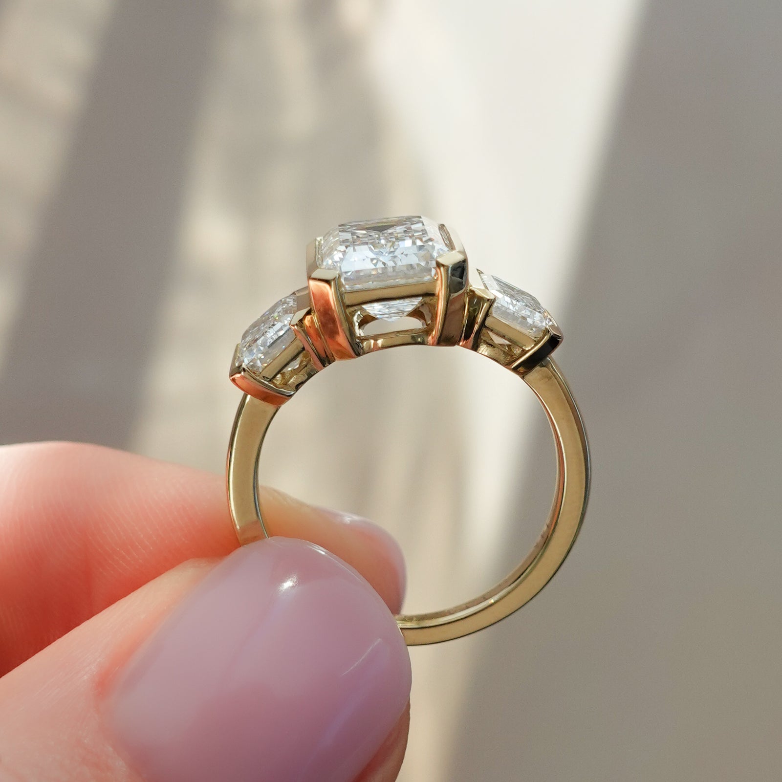Half Bezel Solitaire Engagement Ring With Emerald Cut by Good Stone in Yellow Gold