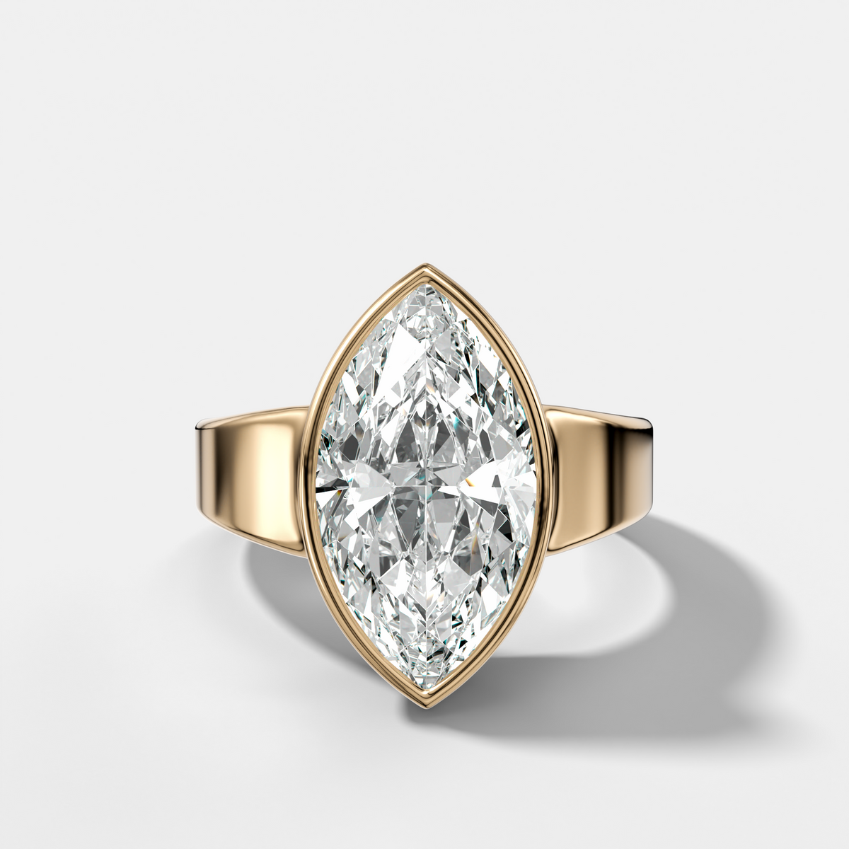 Finest Tapered Bezel Set Engagement Ring With Marquise Cut Diamond