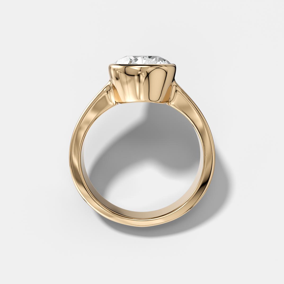 Finest Tapered Bezel Set Engagement Ring With Pear Cut Diamond