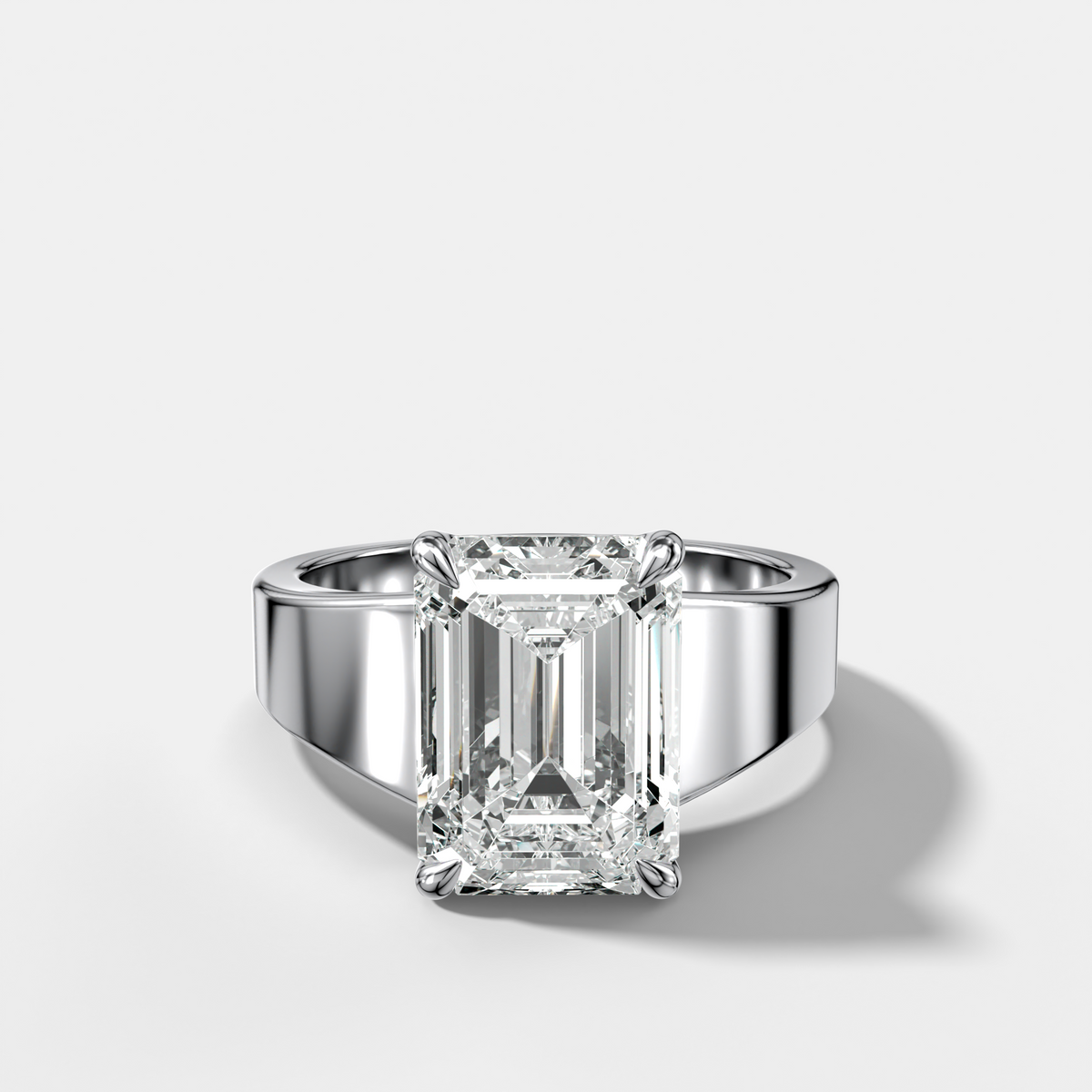 Finest Tapered Engagement Ring With Emerald Cut Diamond