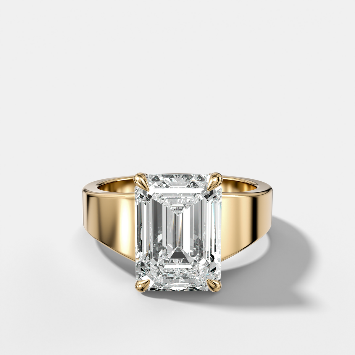 Finest Tapered Engagement Ring With Emerald Cut Diamond