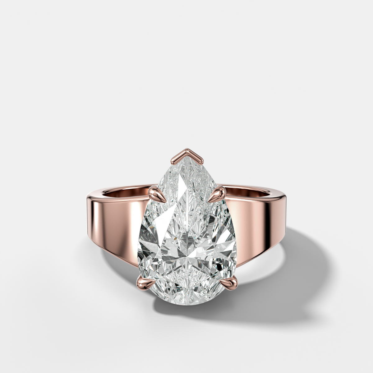 Finest Tapered Engagement Ring With Pear Cut Diamond