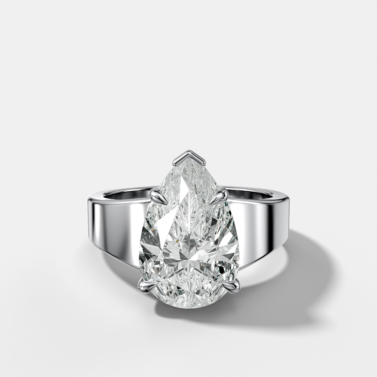 Finest Tapered Engagement Ring With Pear Cut Diamond