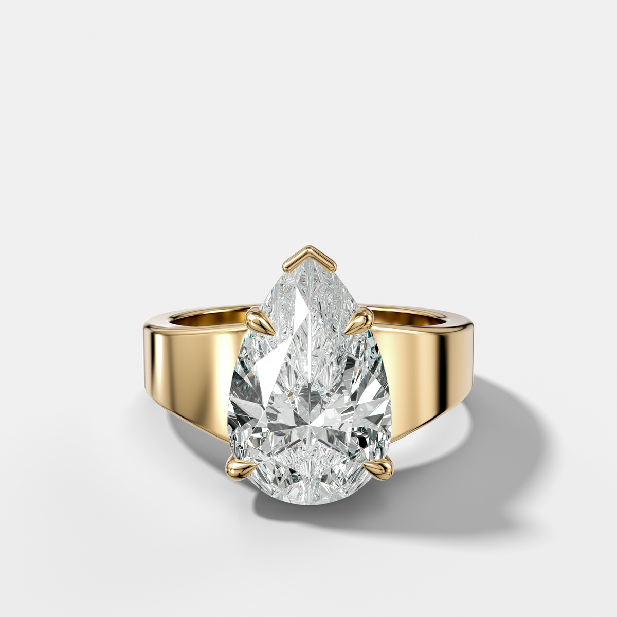Finest Tapered Engagement Ring With Pear Cut Diamond