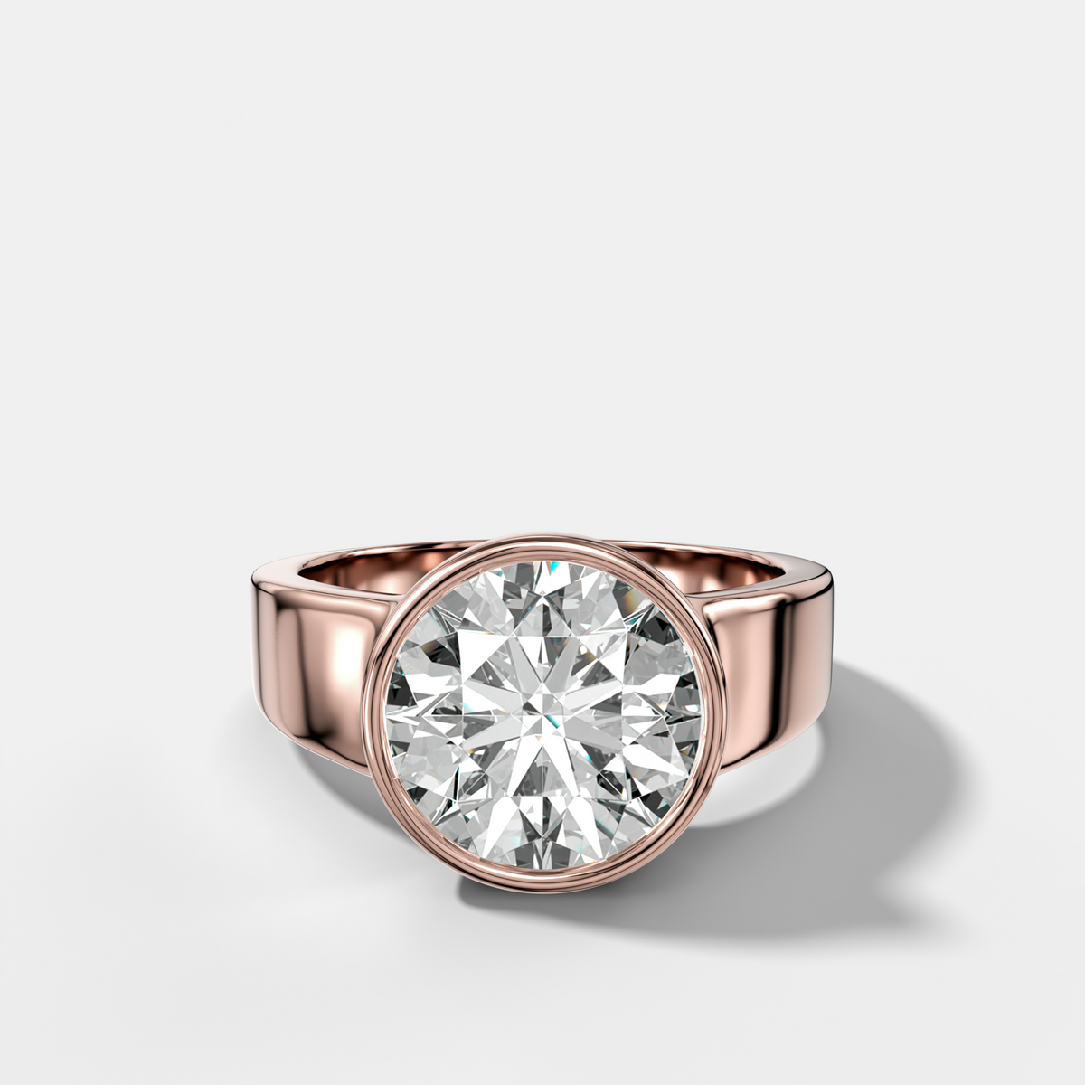 Finest Tapered Bezel Set Engagement Ring With Round Cut Diamond