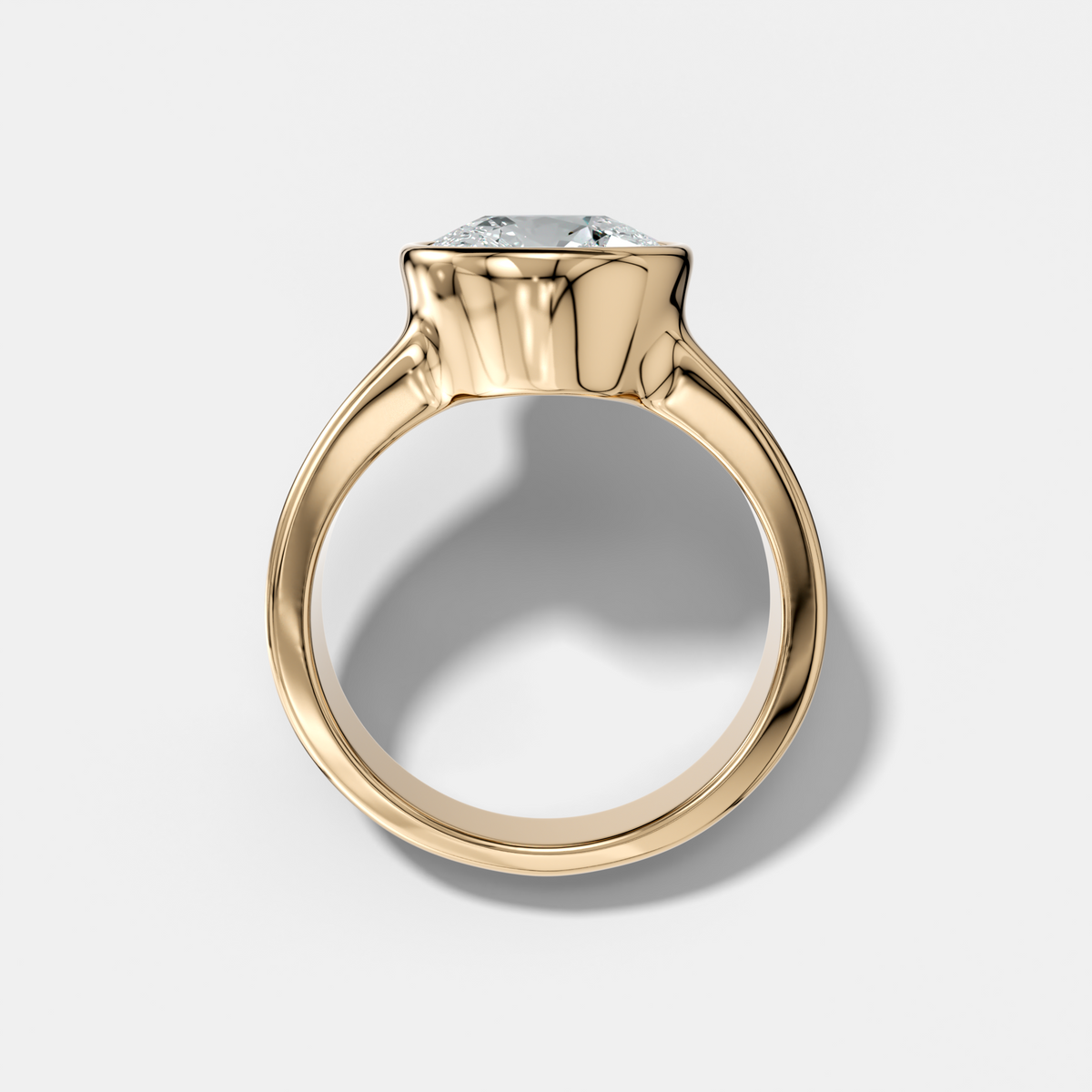 Finest Tapered Bezel Set Engagement Ring With Round Cut Diamond