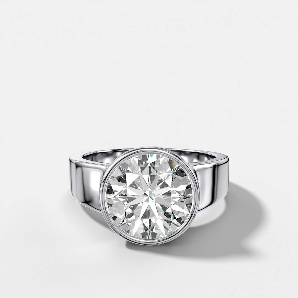 Finest Tapered Bezel Set Engagement Ring With Round Cut Diamond