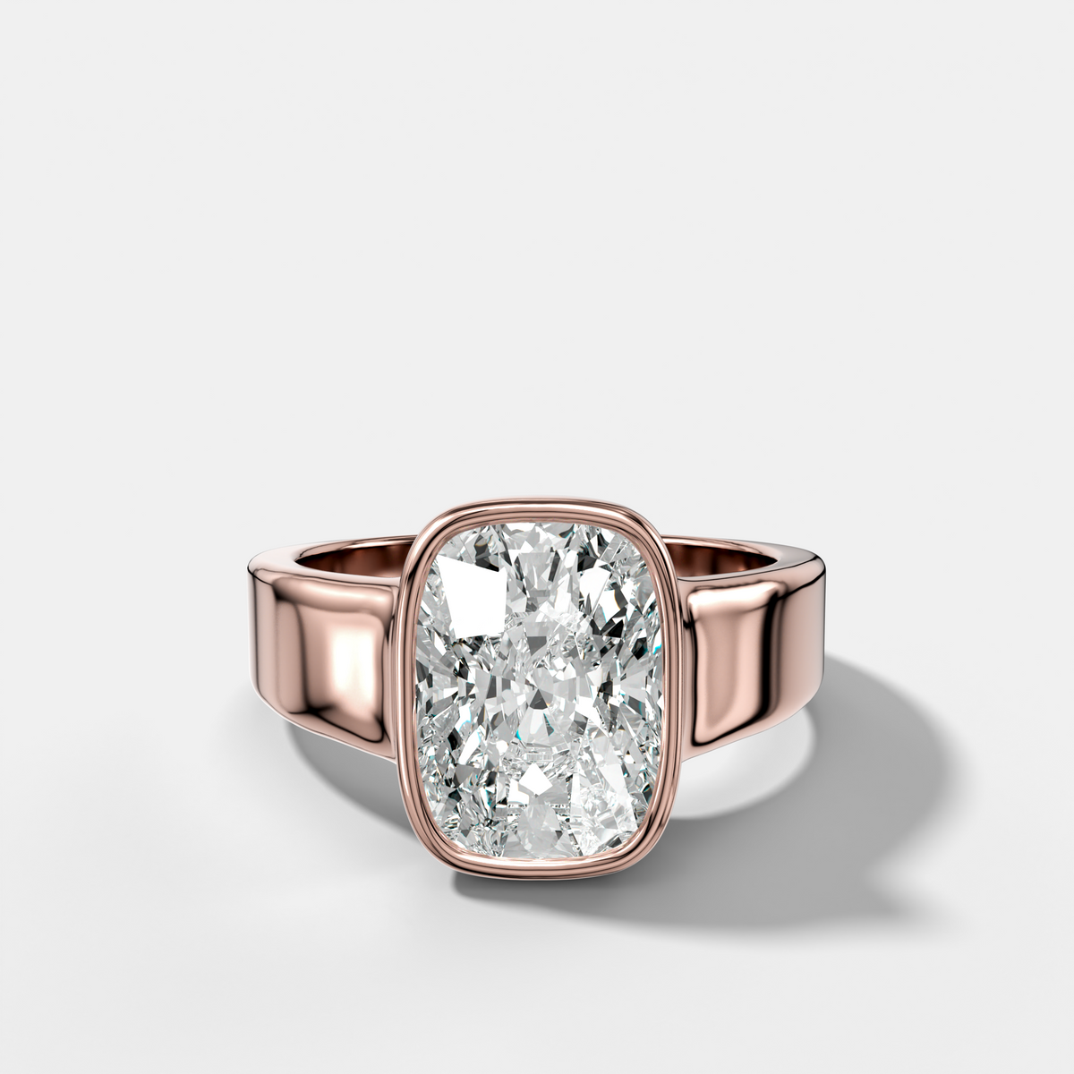 Finest Tapered Bezel Set Engagement Ring With Elongated Cushion Cut Diamond