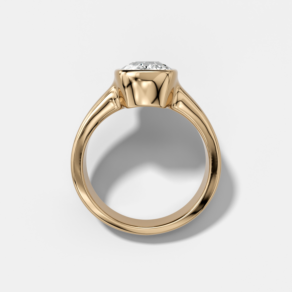 Finest Tapered Bezel Set Engagement Ring With Elongated Cushion Cut Diamond