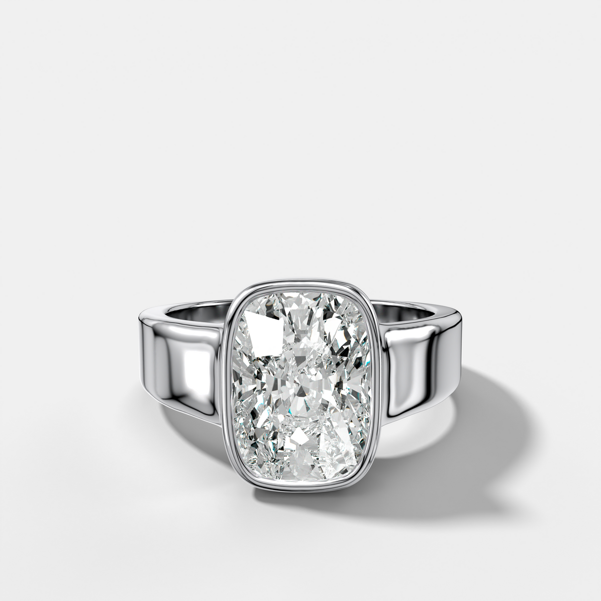 Finest Tapered Bezel Set Engagement Ring With Elongated Cushion Cut Diamond