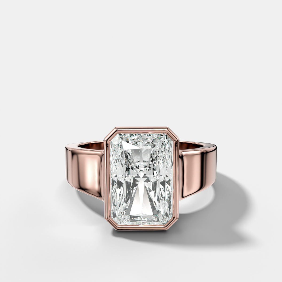 Finest Tapered Bezel Set Engagement Ring With Elongated Radiant Cut Diamond