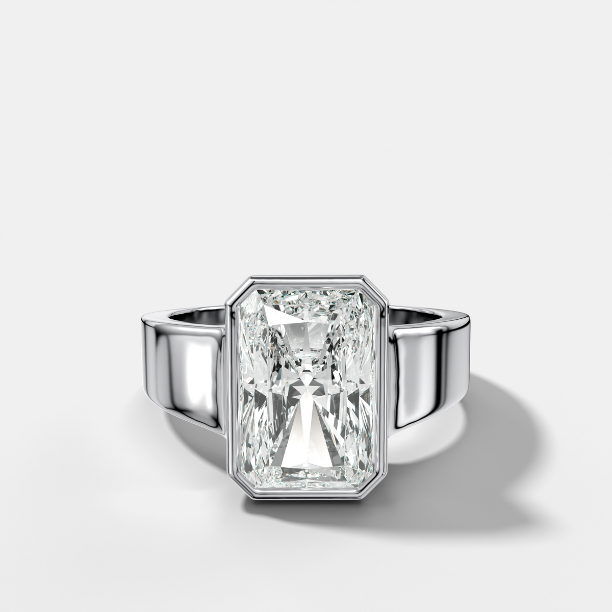Finest Tapered Bezel Set Engagement Ring With Elongated Radiant Cut Diamond