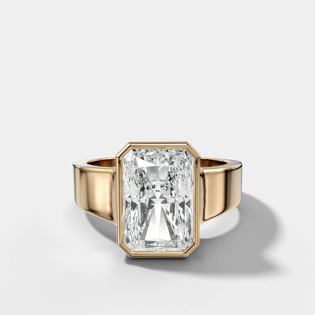 Finest Tapered Bezel Set Engagement Ring With Elongated Radiant Cut Diamond