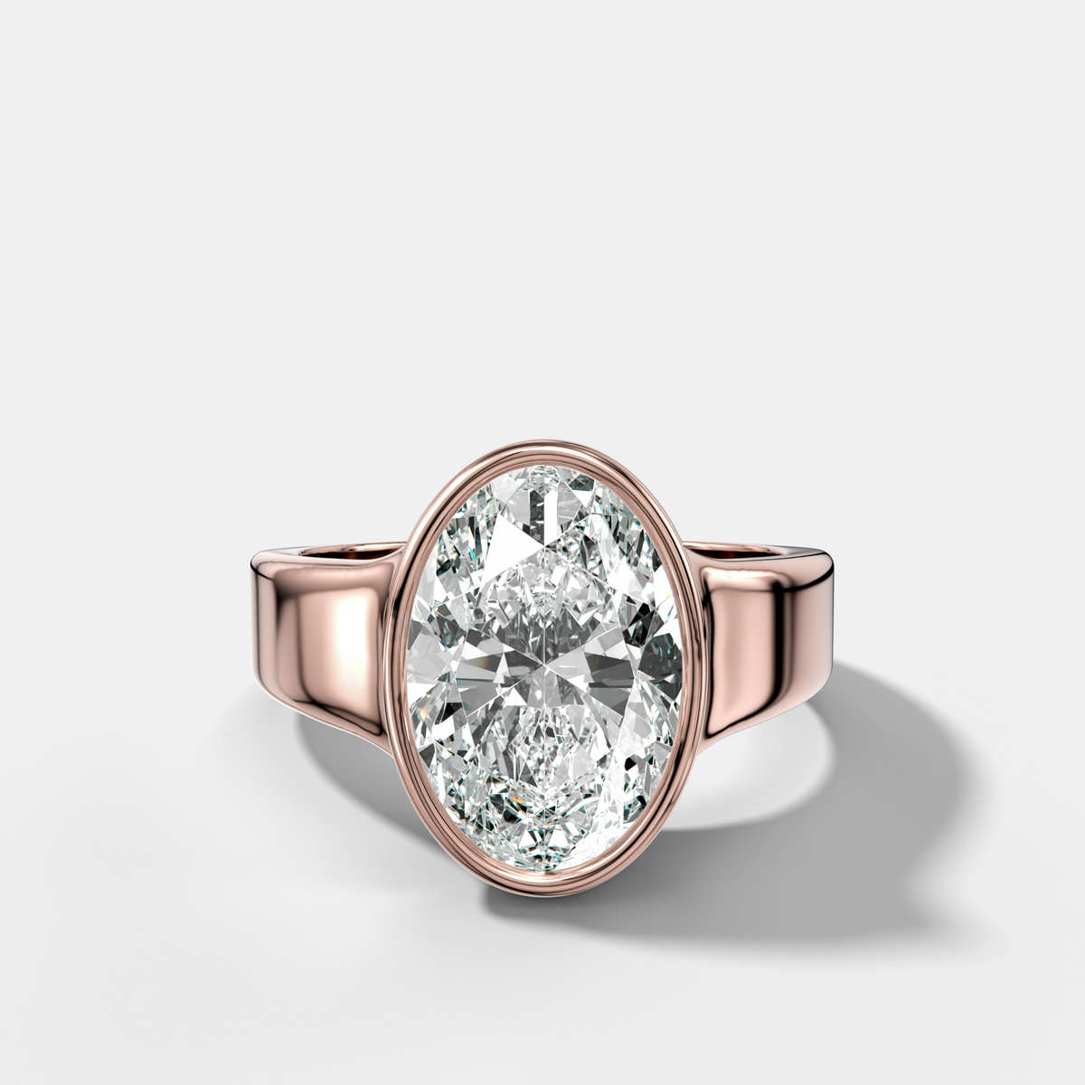 Finest Tapered Bezel Set Engagement Ring With Oval Cut Diamond