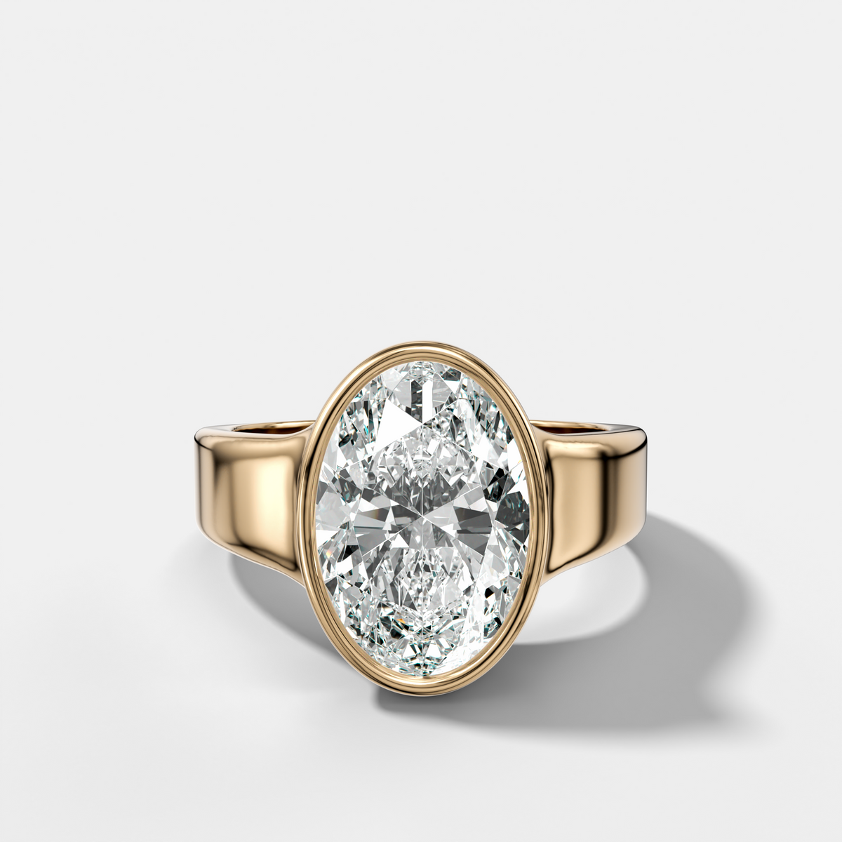 Finest Tapered Bezel Set Engagement Ring With Oval Cut Diamond