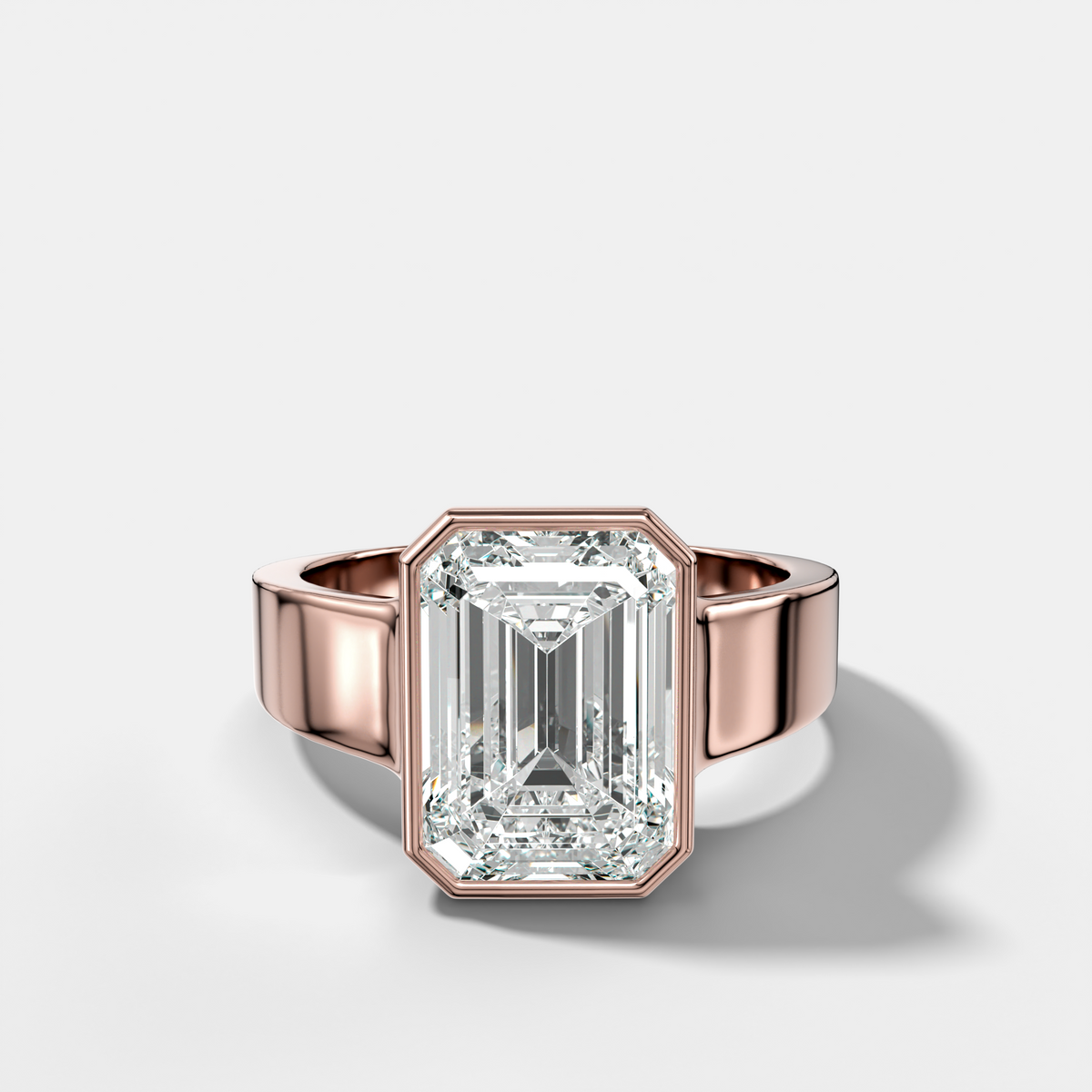 Finest Tapered Bezel Set Engagement Ring With Emerald Cut Diamond