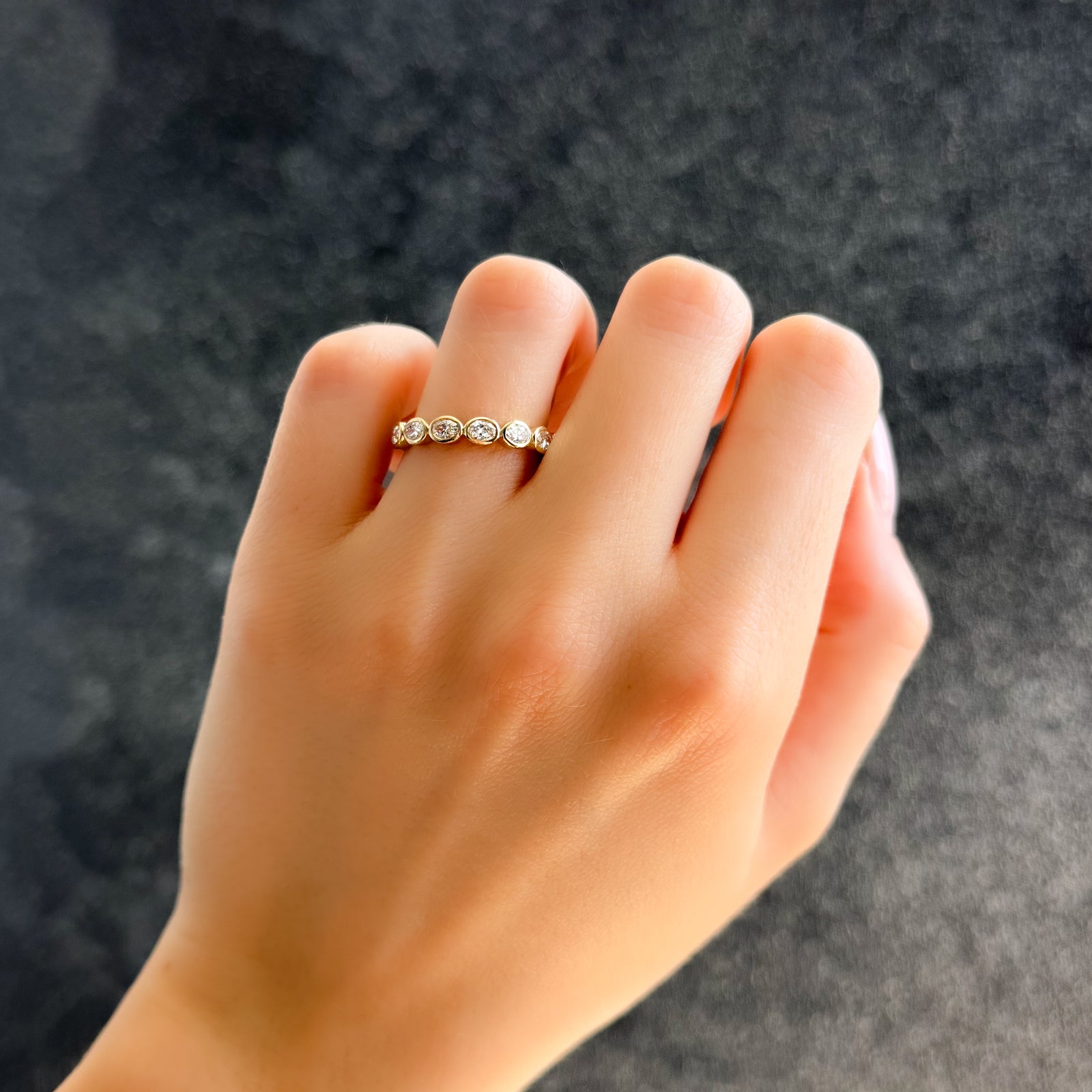 Baby Bezel Set Eternity Band With East West Oval Cuts in Yellow Gold by Good Stone