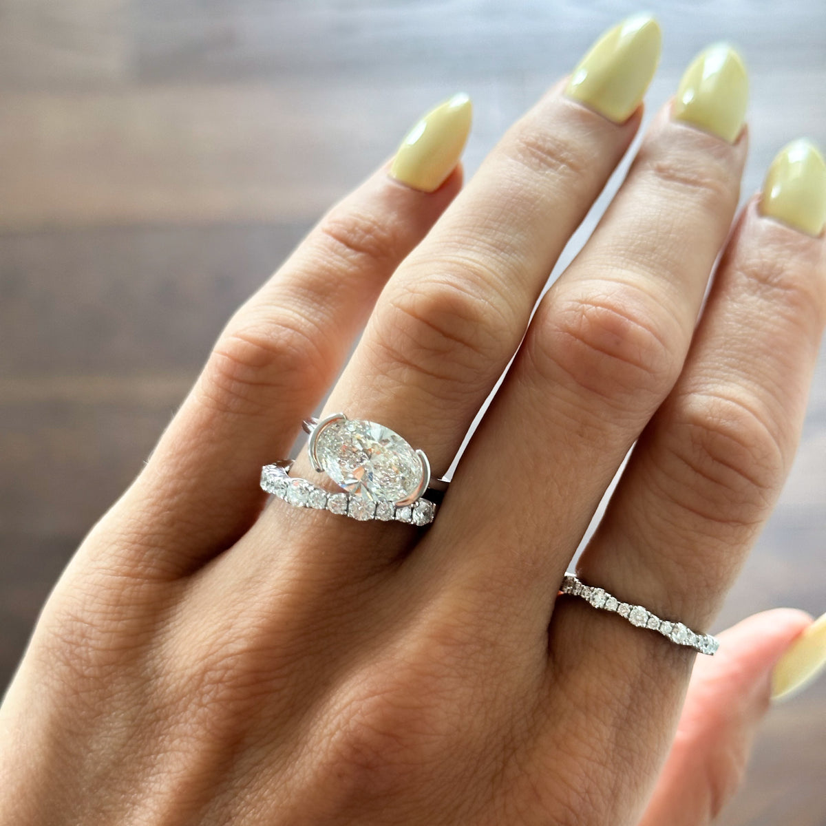 East West Half Bezel Solitaire Engagement Ring With Oval Cut Diamond | GoodStone