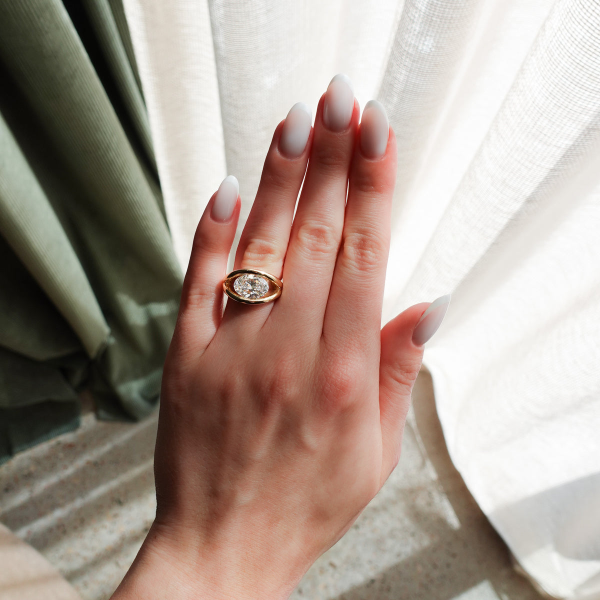 Iris Engagement Ring With an Oval Cut Diamond