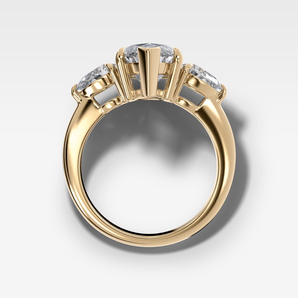 Three Stone Engagement Ring With Pear Side Stones and Marquise Cut Diamond