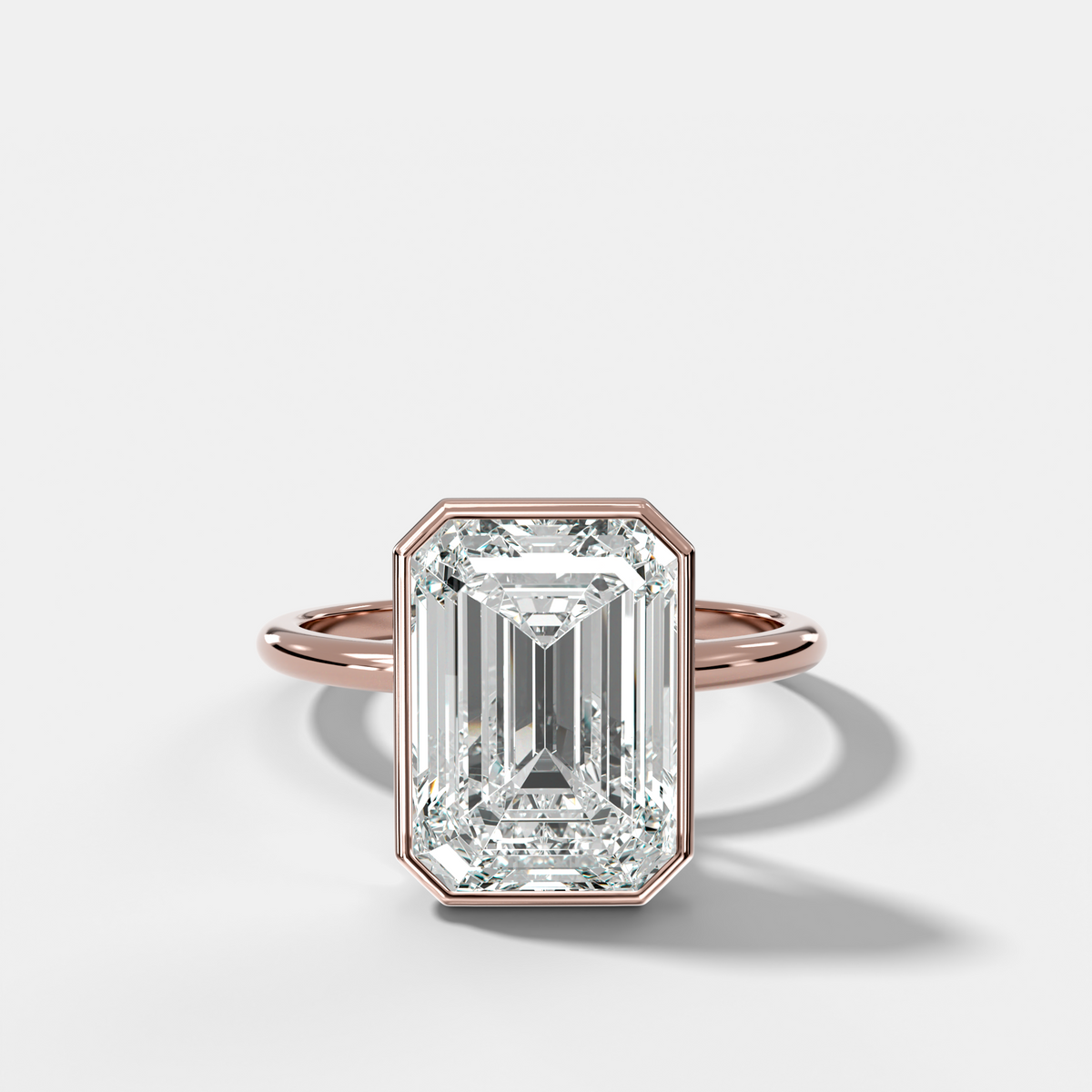 Penumbra Bezel Hidden Halo Engagement Ring with Emerald Cut