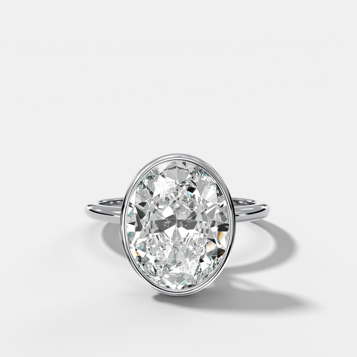 Penumbra Bezel Hidden Halo Engagement Ring with Oval Cut