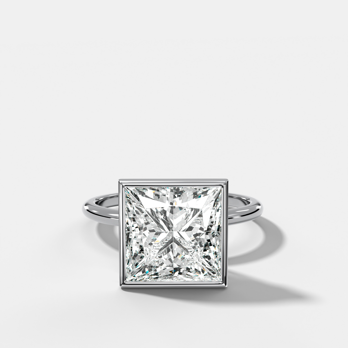 Penumbra Bezel Hidden Halo Engagement Ring with Princess Cut