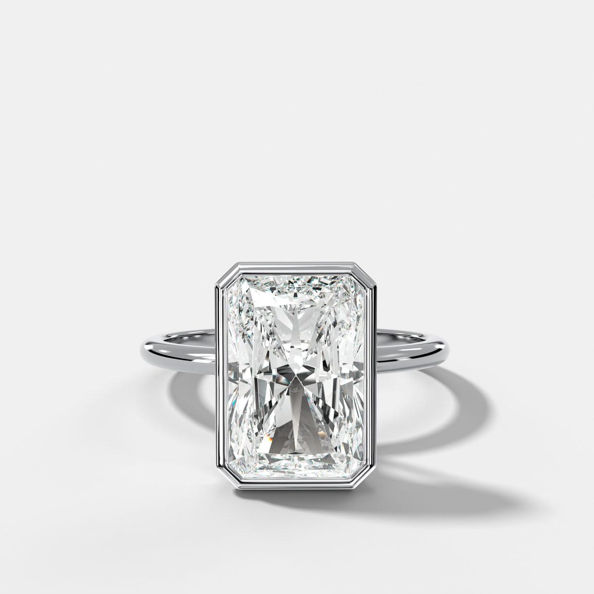 Penumbra Bezel Hidden Halo Engagement Ring with Elongated Radiant Cut