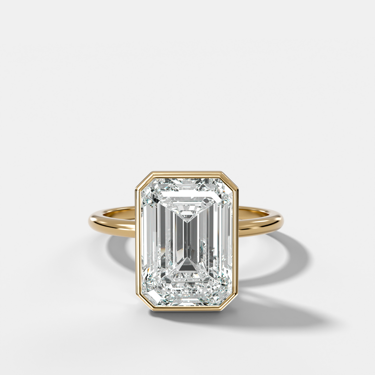 Penumbra Bezel Hidden Halo Engagement Ring with Emerald Cut