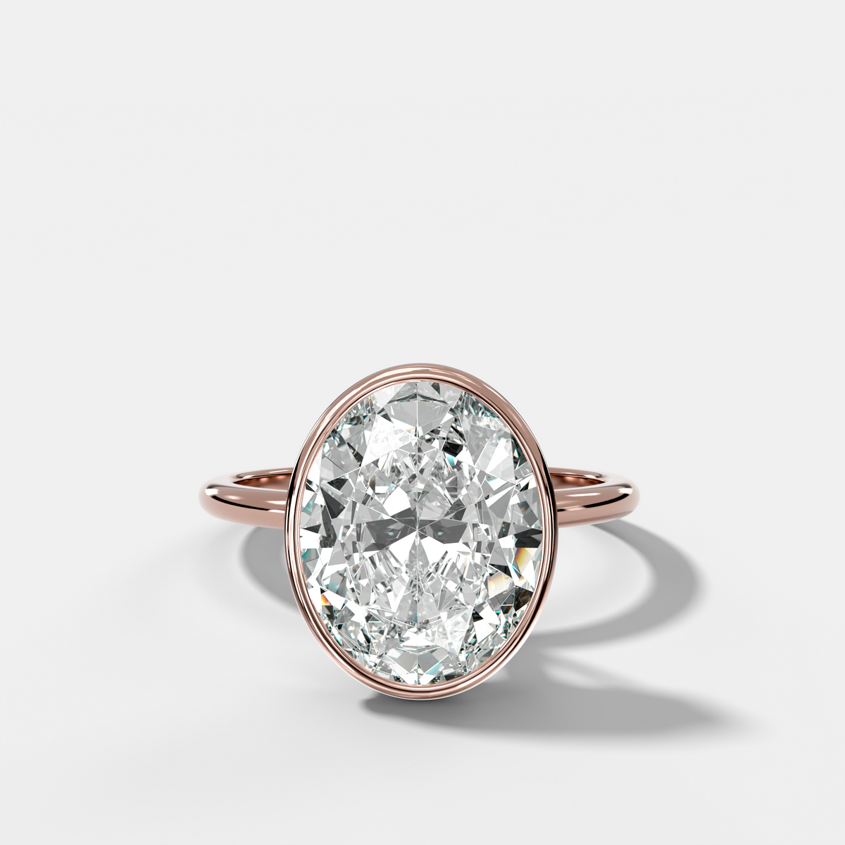 Penumbra Bezel Hidden Halo Engagement Ring with Oval Cut