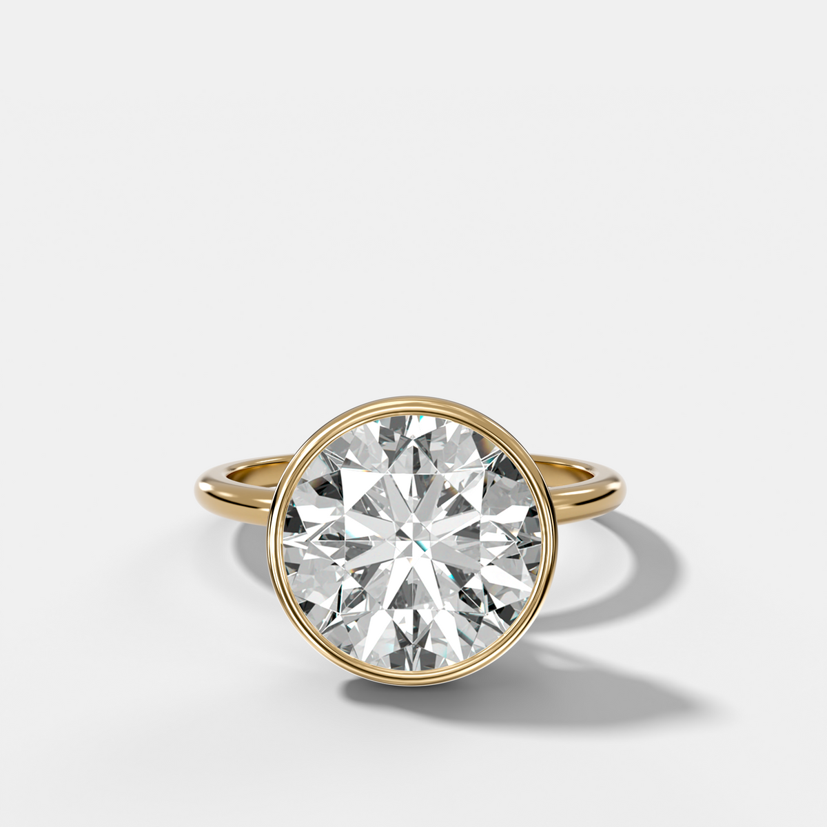 Penumbra Bezel Hidden Halo Engagement Ring with Round Cut
