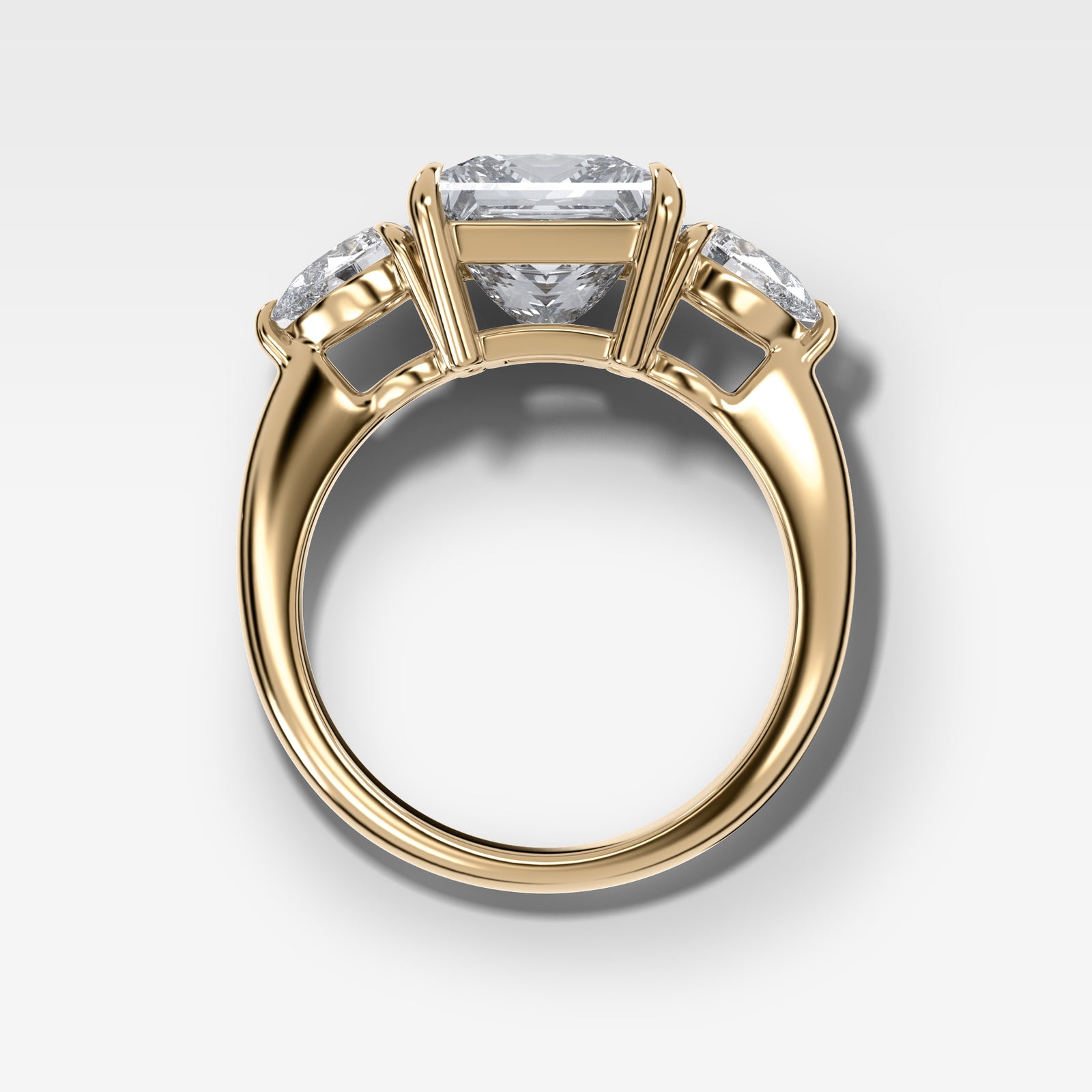 Three Stone Engagement Ring With Pear Side Stones and Princess Cut by Good Stone in Yellow Gold