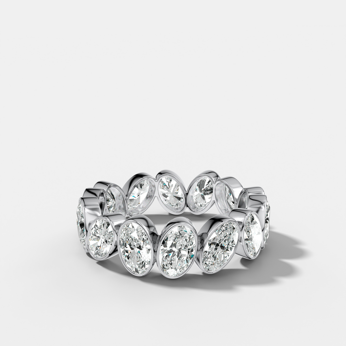 Tilted Bezel Set Eternity Band with Oval Cuts