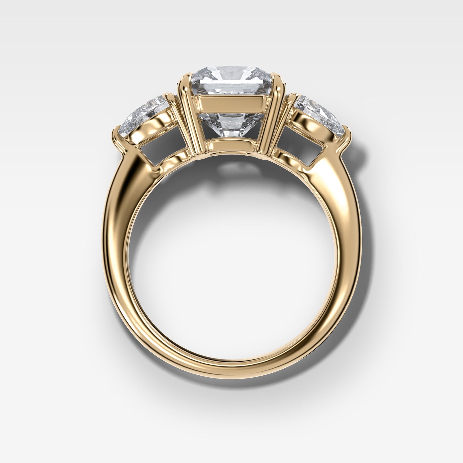 Three Stone Engagement Ring With Pear Side Stones and Radiant Square Cut by Good Stone in Yellow Gold