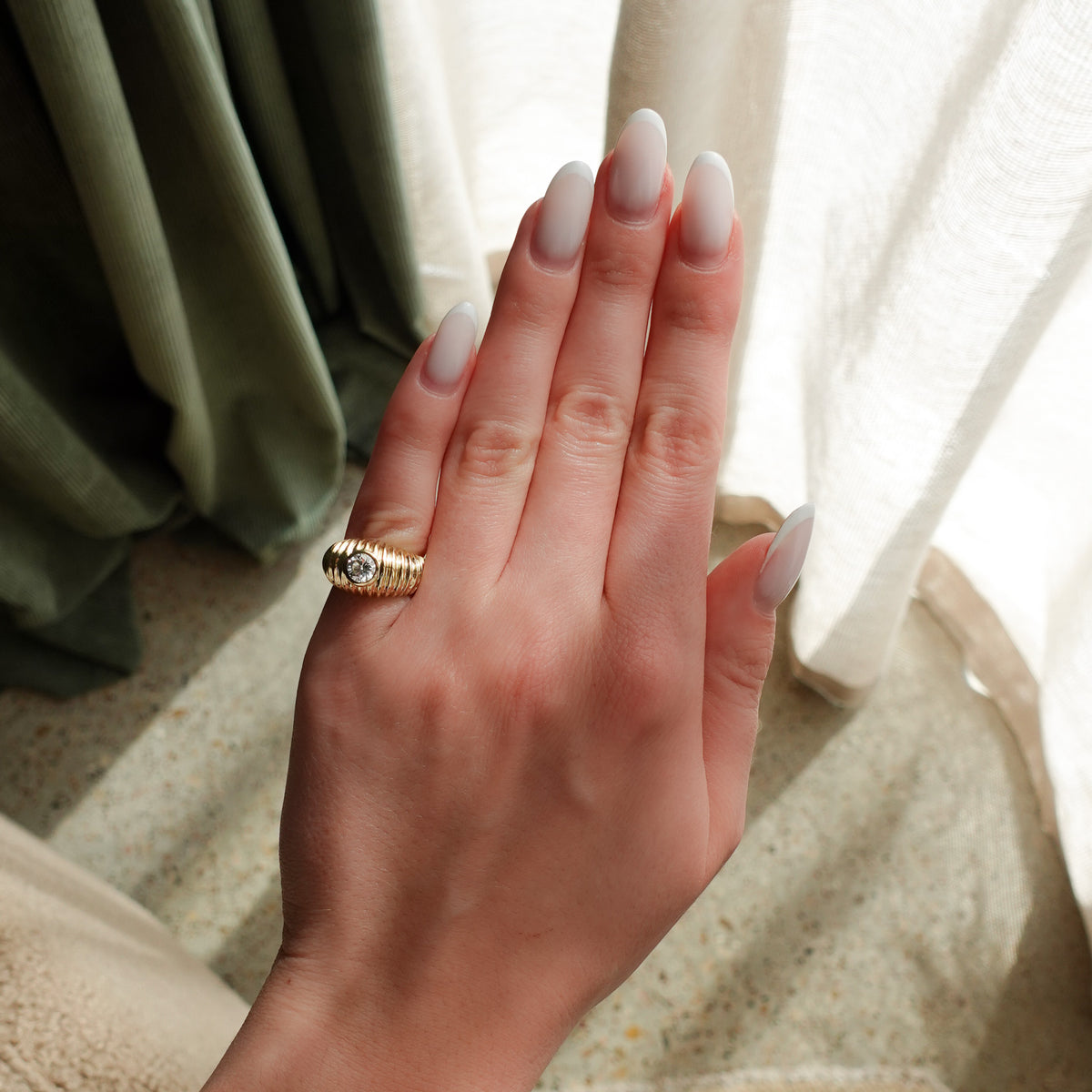 Accordion Cigar Band with a Round Cut Diamond