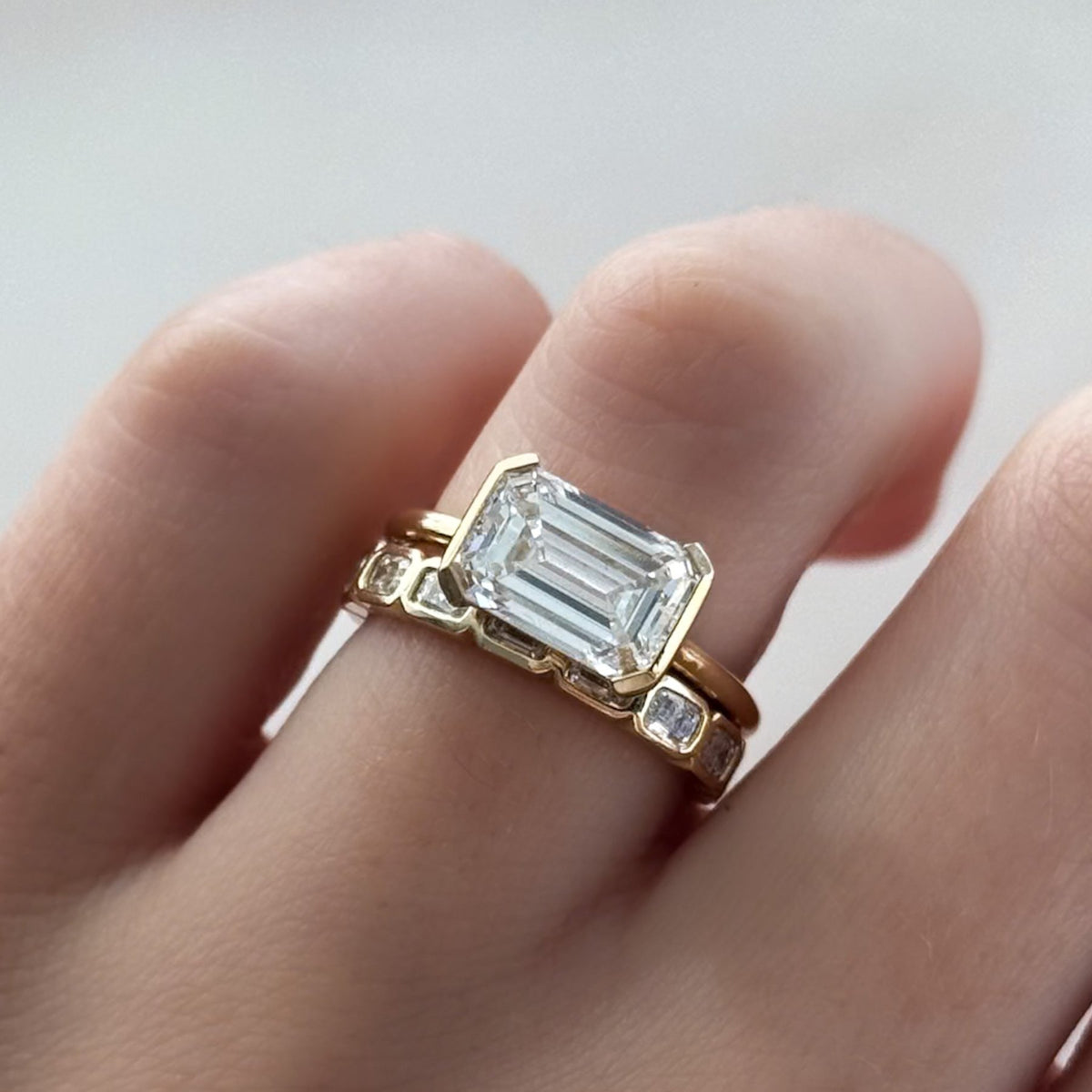 Baby Bezel Set Halfway Wedding Band With East West Emerald Cuts - GOODSTONE