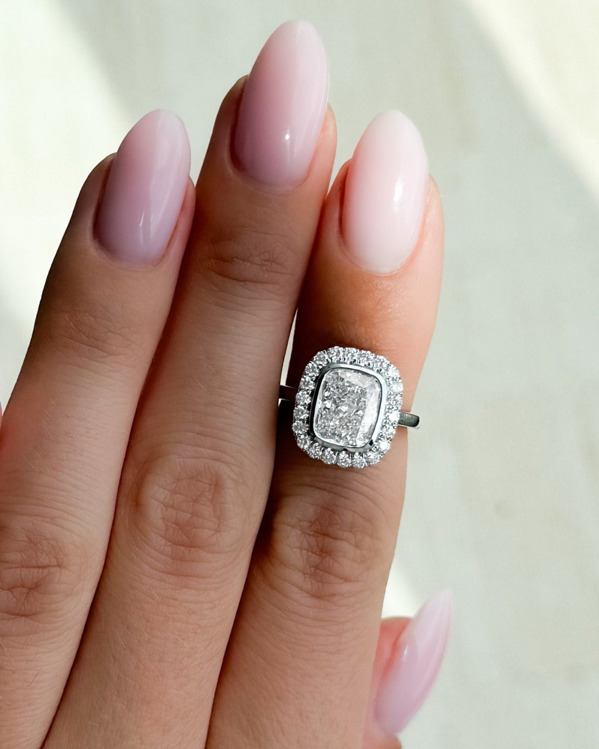 Bezel Set Halo Engagement Ring With Elongated Cushion Cut Diamond - GOODSTONE