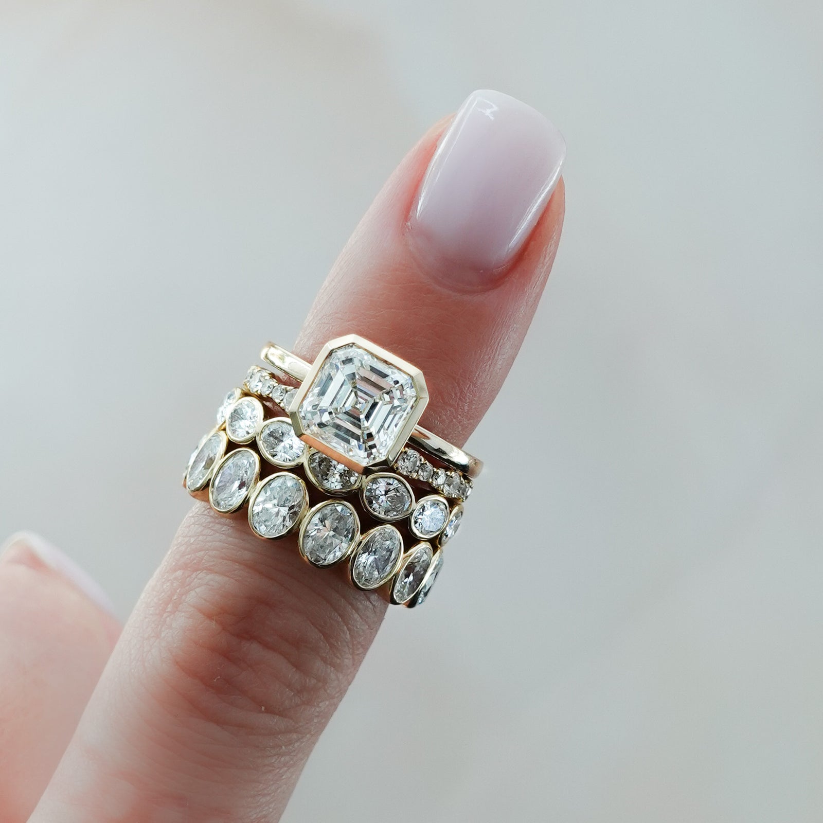 Midi Bezel Set Eternity Band With Oval Cuts in Yellow Gold by Good Stone